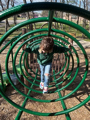 Happy Patient James Climbing On Playground