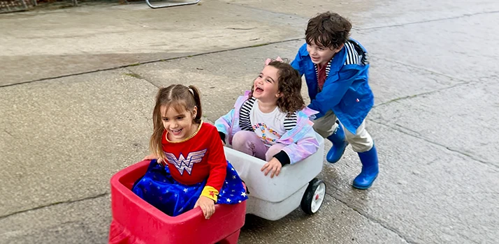 Happy Patient James Pushing Children In A Wagon