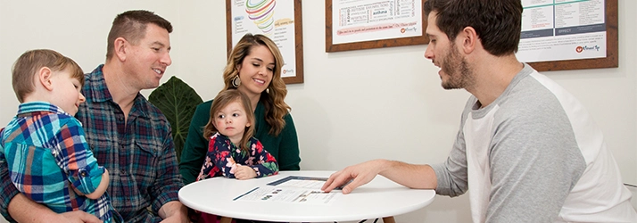 Pediatric Chiropractor Max Carlin Meeting With Family Of Patients