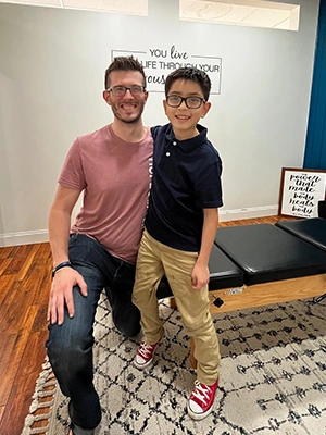 Pediatric Chiropractor Max Carlin With Patient Alec